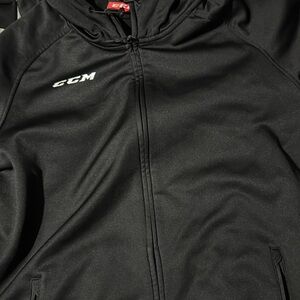 Black CCM zip up sweater size US Large, brand new